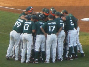 HUDDLE UP: The Miami baseball team gathers together before Sunday\'s deciding game against the Arizona Wildcats. Miami beat Arizona, 4-2, to advance to the College World Series for the twenty-third time in school history. Photo Credit: Christina De Nicola // Hurricane Staff
