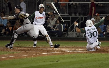 David Villasuso slides in safely for Miami's first run during the second inning of Friday night's 2-1 victory // Jess Hodder