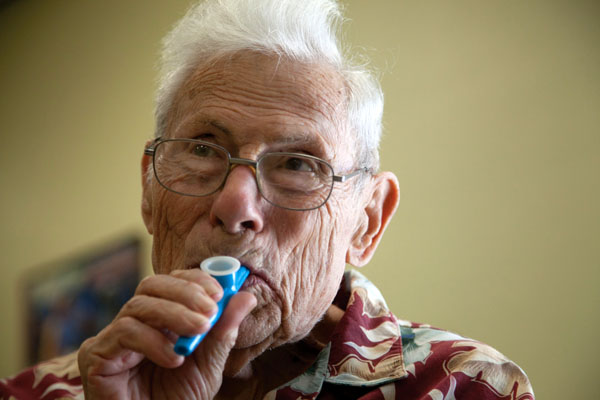 Victor Trivett, 88, plays on his blue kazoo. The instrument is used to help regulate the breathing of people with Parkinsons. Trivett was a ballroom dancer and a disk jockey for over thrity years, which ended when he began to manifest the symptoms of Parkinson's disease over a year and a half ago. Now, his caretaker, Trudy Milone, 71, comes with him to music and dance therapy classess at the church. Cayla Nimmo // Photo Editor