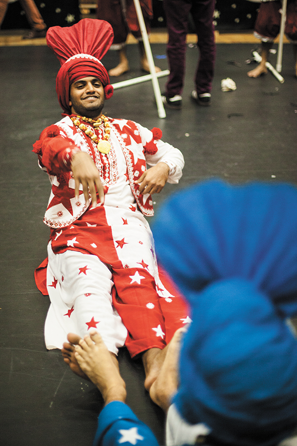 Senior Arjun Anand warms up backstage with his Hurricane Bhangra teammates. Bhangra is an Indian folk dance. The participating UM teams did not compete, but performed as part of the exhibition. Monica Herndon // Assistant Photo Editor