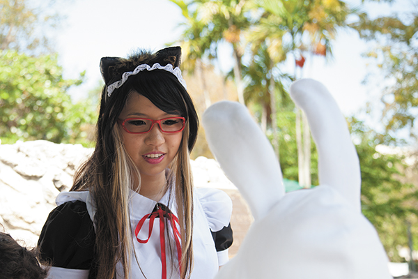 Sophomore Vienna Sa serves snacks as a part of the Maid's Cafe at the Hurry Con on Sunday. Maid's Cafes are cosplay restaurants, traditionally found in Japan where the servants dress as French maids. Monica Herndon // Assistant Photo Editor
