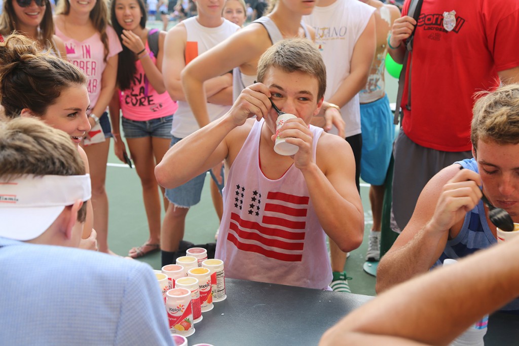 Junior Tim Smith competes in the Zeta Tau Alpha yogurt eating contest on Friday during Think Pink Week. Torie O'Neil // Contributing Photographer
