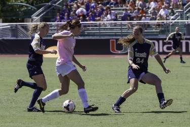 Ashley Flinn drives past two Notre Dame players and scores a goal during the second half of Sunday's game. Nick Gangemi // Assistant Photo Editor