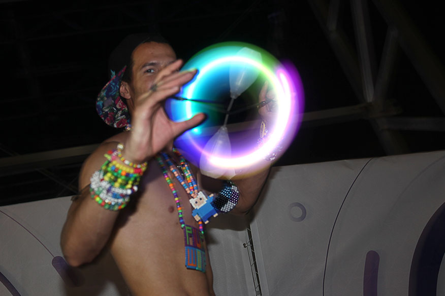 Jeffrey Rojas of Pembroke Pines performs a small light show outside the Carl Cox stage at Ultra on Saturday night.