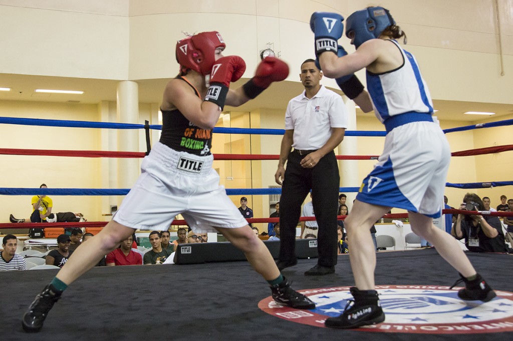 Junior Jillian Kernan fights an opponent from West Point during Thursday's boxing tournament held at the Wellness Center. Kernan won the fight by a technical knockout and went on to claim the women’s national title for the 132lb weight class. Nick Gangemi // Assistant Photo Editor