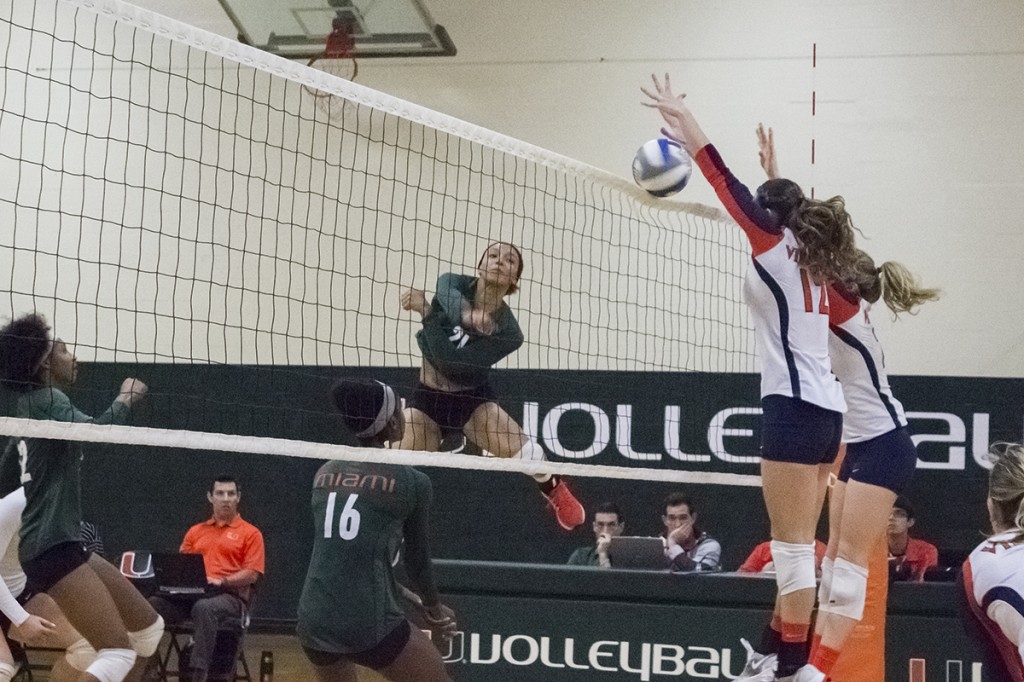 Senior Savanah Leaf spikes the ball during Sunday’s game against Virginia. Leaf led the team with 17 kills, helping the Canes defeat the Cavaliers 3-1. Giancarlo Falconi // Staff Photographer