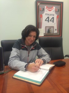 University of Miami women's basketball Coach Katie Meier signs the ODK initiation roll book. // Courtesy UMiami ODK