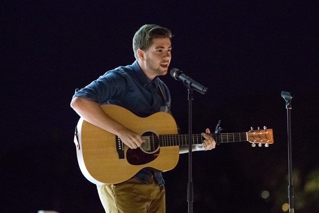 Senior Michael Fenuccio performs during UPride’s Open Mic event, conducted as part of Social Justice Week, held on the Lakeside Patio Stage Wednesday night. Nick Gangemi // Photo Editor