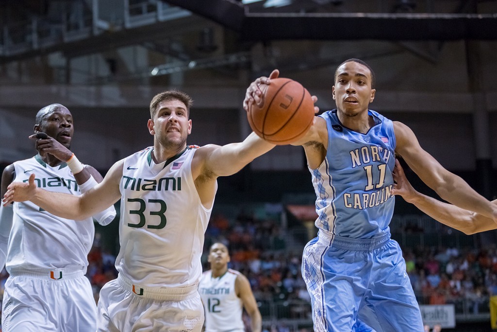 Junior Ivan Cruz Uceda (No. 33) battles North Carolina's Brice Johnson (No. 11) for the recovery of a ball headed out-of-bounds. Nick Gangemi // Photo Editor