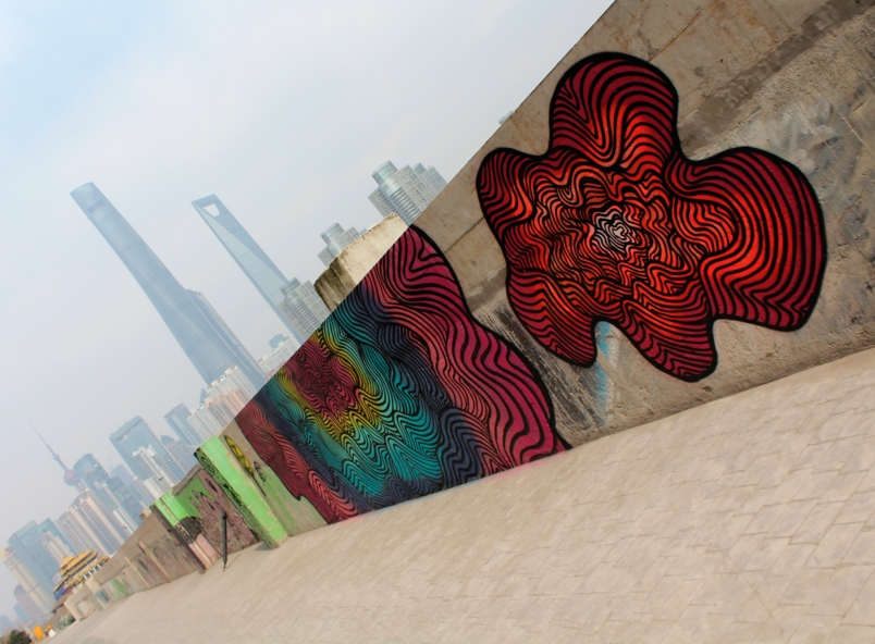 Street art on the Bund in Shanghai brightens up the bleak and polluted skyline in the city of Shanghai. // Jamie Servidio
