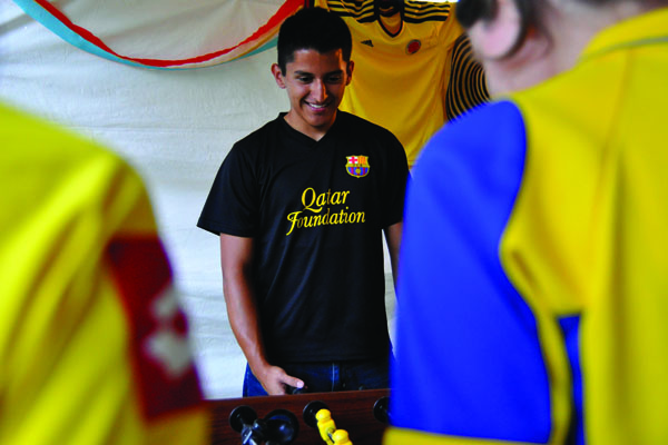 Raul Velarde plays foosball in the Columbia tent during a past South American themed night for International Week. This annual event put on by COISO is a week-long celebration of world cultures and takes place April 6-10. File Photo by Holly Bensur // Staff Photographer