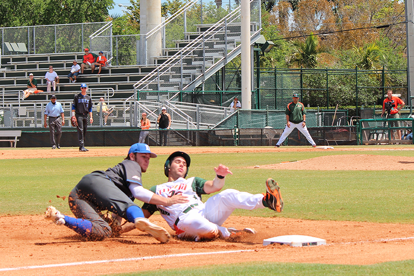 Garrett Kennedy (No. 40) slides into third base in the bottom of the third inning in the last game of the series against Duke. The Canes beat the Blue Devils 10-0 and swept the series Sunday. Hallee Meltzer // Assistant Photo Editor