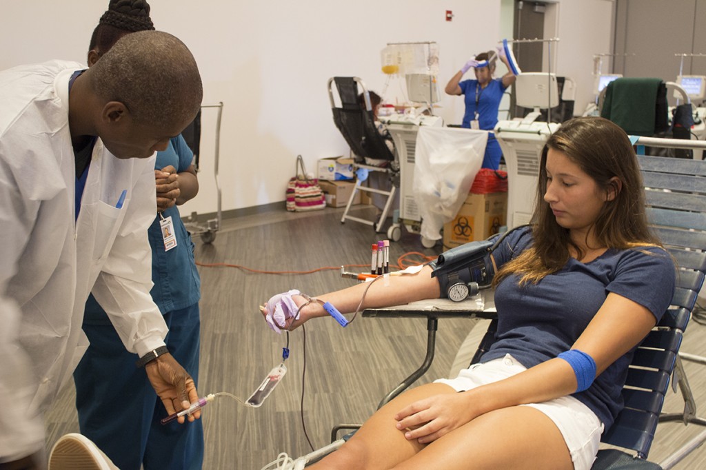 Freshman Isabella Antonioni donates her blood during the "Battle for the Bucket" Blood Drive Tuesday afternoon. For "Battle for the Bucket", hosted by FunDay, UM competes against Florida State University for the most pints of blood donated. Shreya Chidarala // Staff Photographer