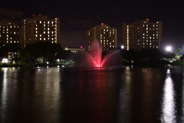 In support of Breast Cancer Awareness, Zeta Tau Alpha sorority lights Lake Osceola's fountain pink Monday evening.  Evelyn Choi // Contributing Photographer