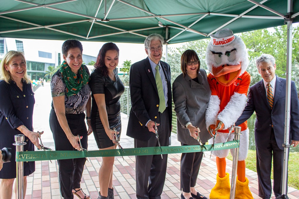 The Weese Family, President Frenk, members of the Board of Trustees, and UM administration gather for the dedication and ribbon cutting ceremony of Fate Bridge Wednesday morning. Fate Bridge is now open and connects the Eaton parking lot to the Lakeside Patio. Giancarlo Falconi // Assistant Photo Editor