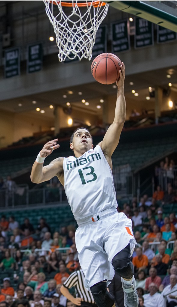 Redshirt senior Angel Rodriguez (No. 13) goes up for a layup in the first round of the 2014-2015 NIT. File Photo // The Miami Hurricane