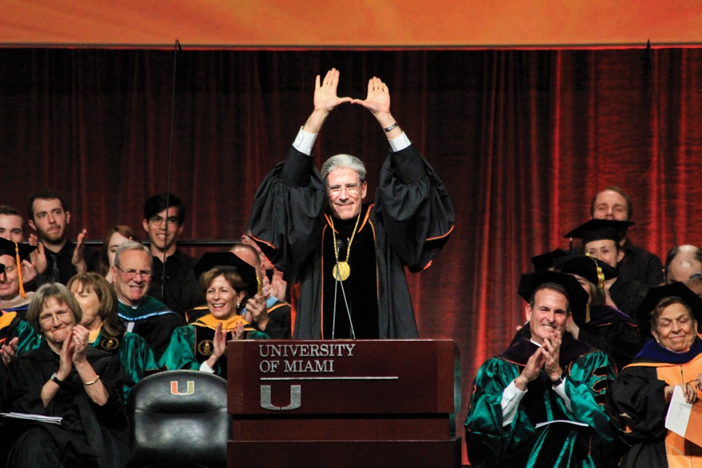 The sixth President of the University of Miami Julio Frenk throws up the “U” to conclude his speech at the inauguration ceremony in the BankUnited Center Friday afternoon. Victoria McKaba // Assistant Photo Editor