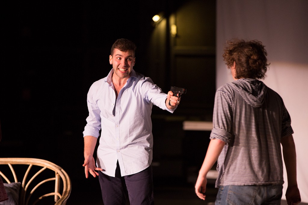 Jim, played by Bennett Leeds, points a gun at Aaron, played by Jacob Garwood, during in "The Killer Inside," the second of six plays performed Saturday evening at the Jerry Herman Ring Theatre for The 24 Hour Plays event. Nick Gangemi // Editor-in-Chief