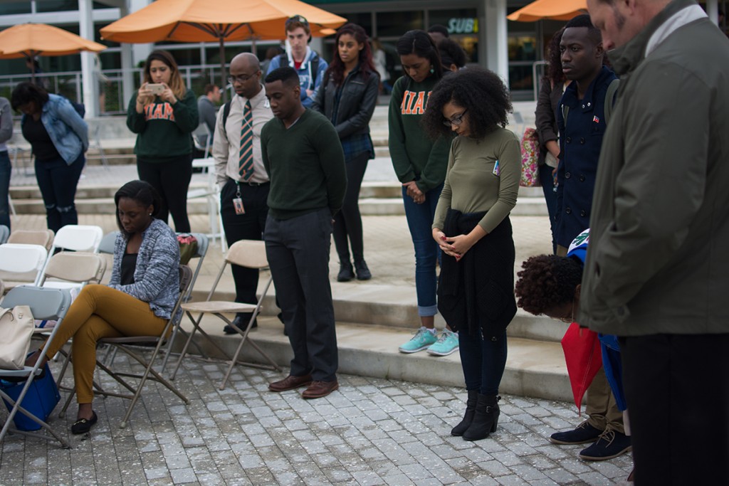 Students bow their heads in a moment of silence during Wednesday’s Haiti earthquake remembrance ceremony at the Lakeside Patio. Planet Kreyol hosted the event to honor the victims of the earthquake that struck Haiti in 2010. Alisha Kabir // Staff Photographer