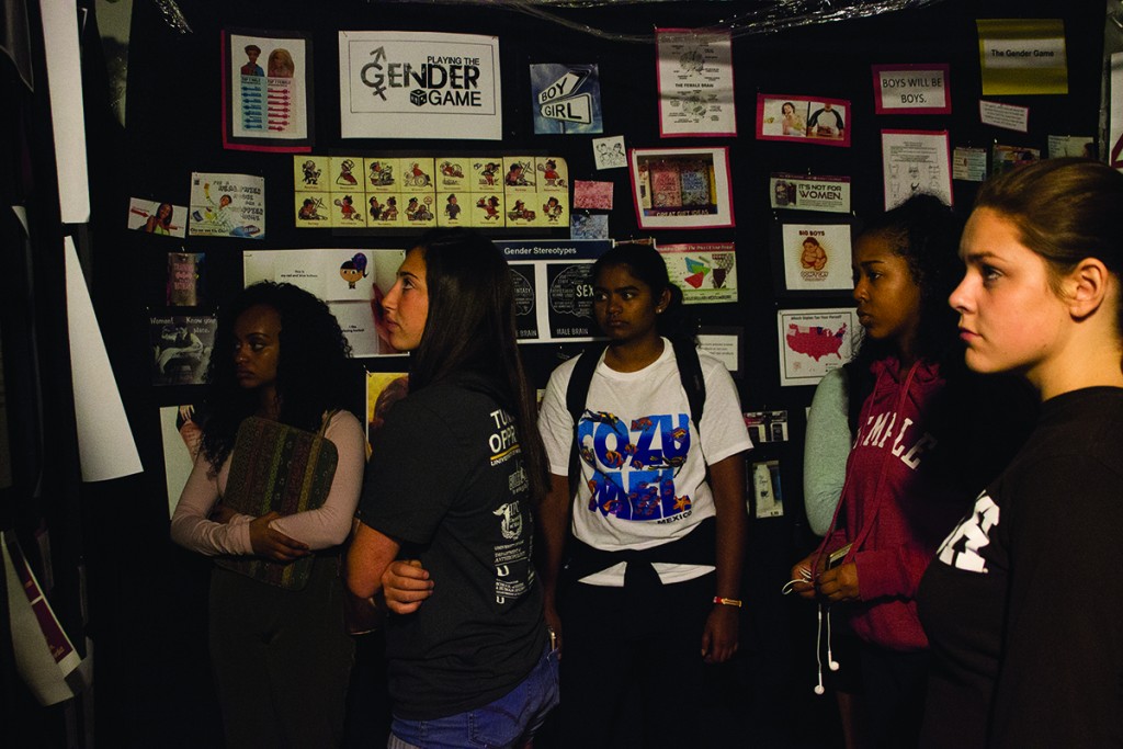 A group of students ponders the gender section of the Tunnel of Oppression exhibit Wednesday evening in the Shalala Student Center. Giancalo Falconi // Staff Photographer