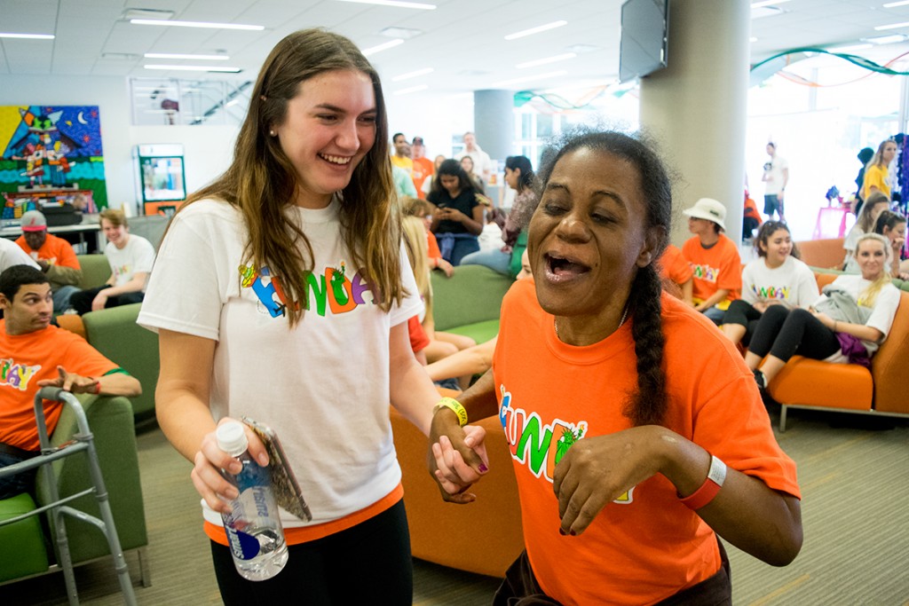 Freshman Taylor McCloskey and her FunDay partner Susy share a laugh in the University Center Saturday afternoon. FunDay is the longest standing service day at the University of Miami and brings over 300 special citizens from the surrounding area on campus to enjoy a day of fun and games. Evelyn Choi // Staff Photographer