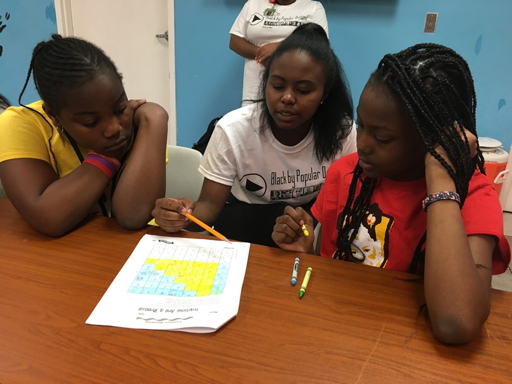 During Saturday's Black Awareness Month Day of Service, freshman Kyra Freeman works with students at the Overtown Youth Center. Amanda Herrera // Contributing Photographer