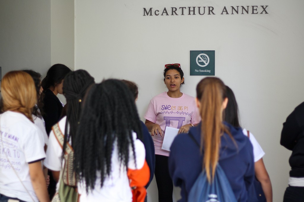 Freshman Bruna da Silva leads a group of high school scholars on a tour of the College of Engineering during the Society of Women Engineers' Introduce a Girl to Engineering Day Thursday morning. Kawan Amelung // Staff Photographer