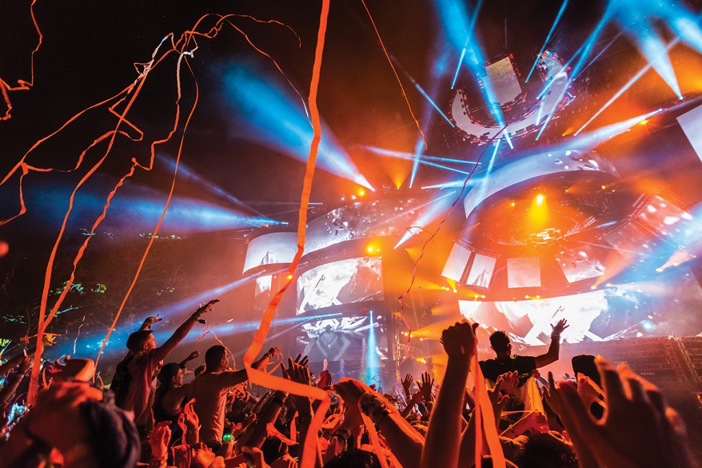 Festival-goers dance as confetti strings fly from the Ultra Main Stage March 2015. The festival announced it will be streaming two different radio programs that will provide live coverage: Ultra Live and UMF Radio. Nick Gangemi // Editor-in-Chief