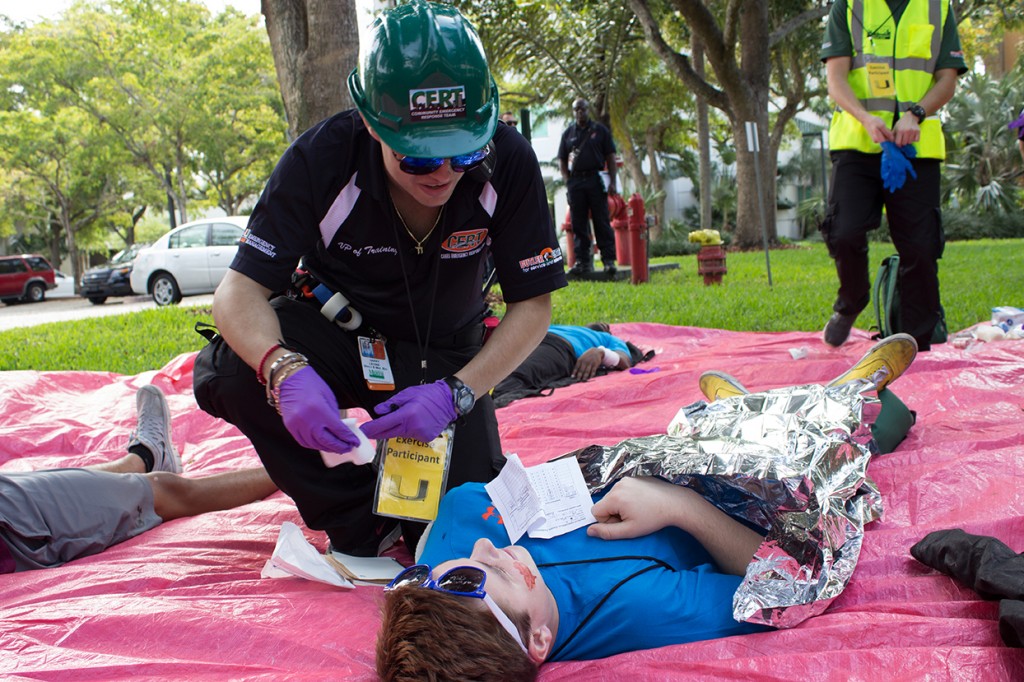 CERT Vice President of Training Harry Levine administers aid outside of the Memorial building during the CERT Disaster Readiness Exercise Sunday. Giancarlo Falconi // Staff Photographer