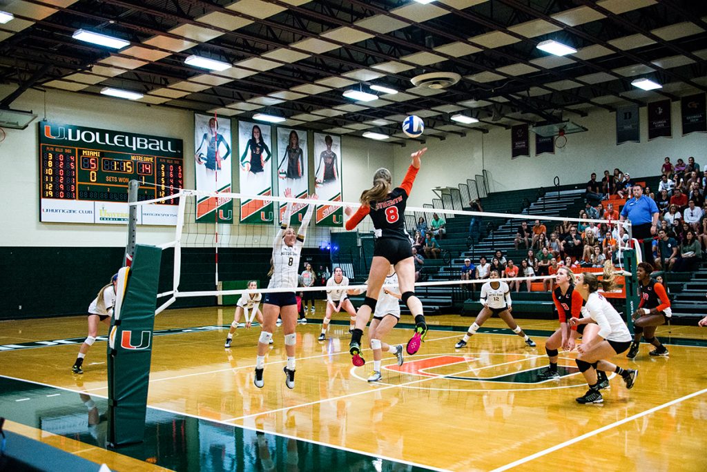 Sophomore outside hitter Anna Haak (8) jumps up to return the ball during the Hurricanes’ 3-0 loss to Notre Dame at the Knight Sports Complex Sunday afternoon. Ben Spiro // Contributing Photographer