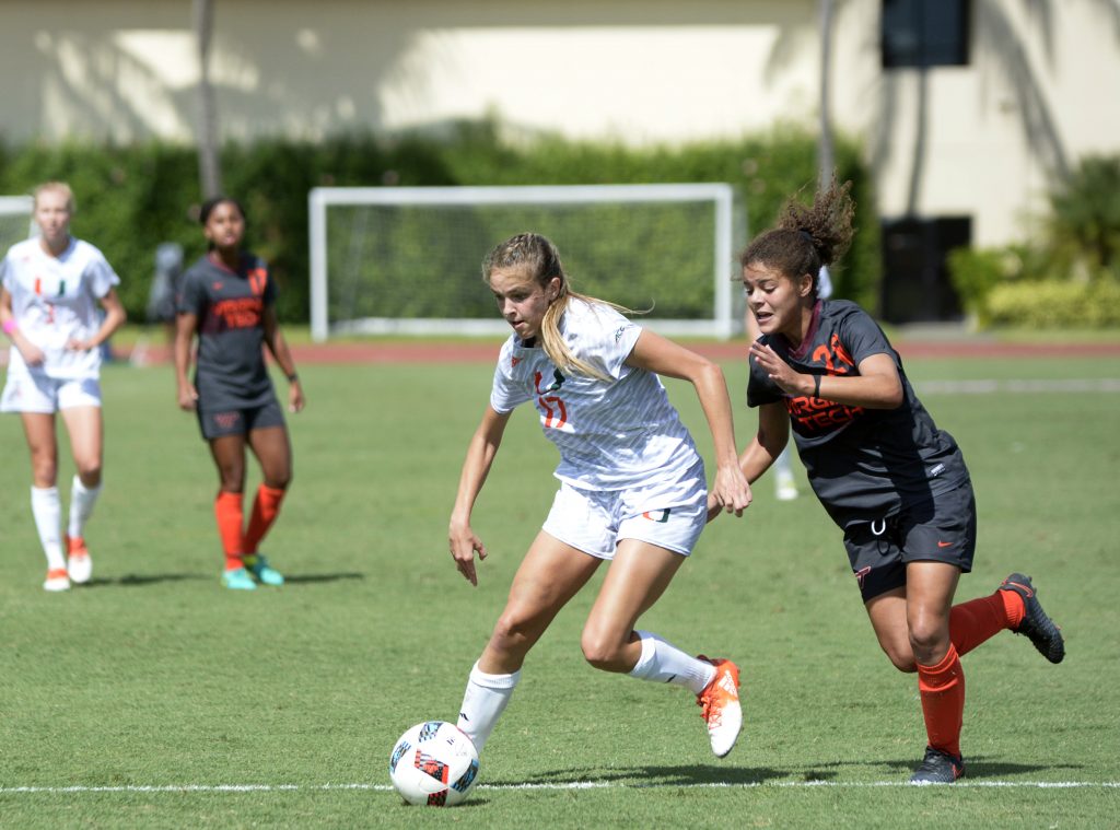 Senior forward Gracie Lachowecki (17) breaks away from a Virginia Tech player during the Canes’ 2-1 overtime win to clinch an ACC tournament berth at Cobb Stadium Sunday afternoon. Josh White // Staff Photographer