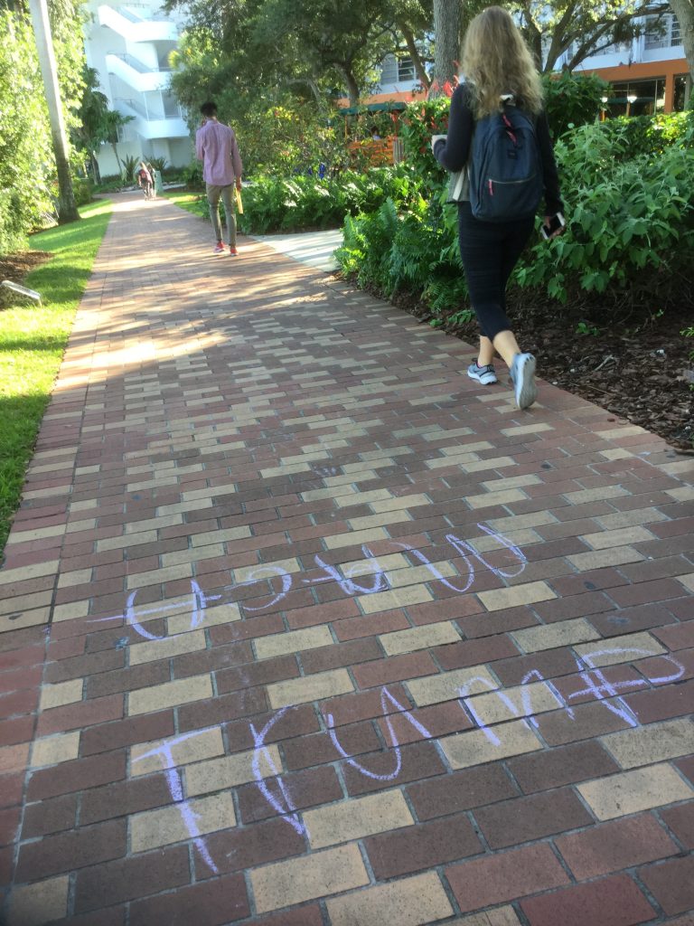 Chalk messages on campus pathways promoted Donald Trump Tuesday morning. Outside Eaton, the walkway was marked with "Trump" and "MAGA," which stands for Trump's campaign slogan of Make America Great Again. // Julie Harans, Editor-in-Chief