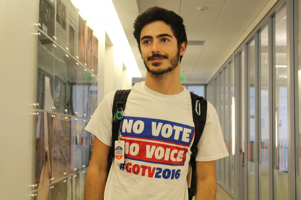 Junior Joe Reda, who voted this morning at St. Augustine Church, wears the shirt he designed for University of Miami Division of Student Affairs and Get Out the Vote. // Jackie Yang, Managing Editor.