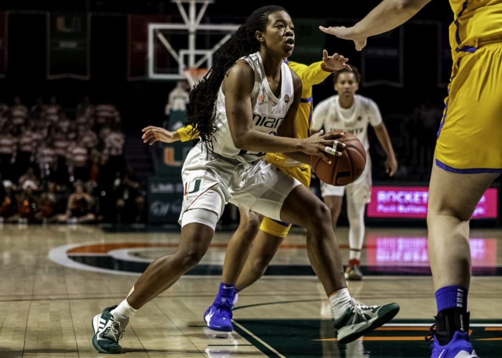Junior Kelsey Marshall looks to make a pass in Miami's win over Pitt on Sunday, March 3. Marshall led the Canes with 21 points.