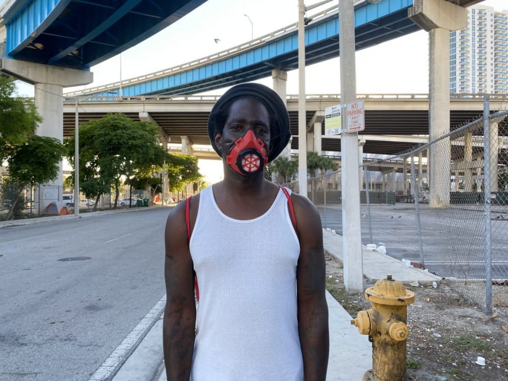 One man wears a red Miami Strong mask he received from the Levine brothers on Sunday, May 4.