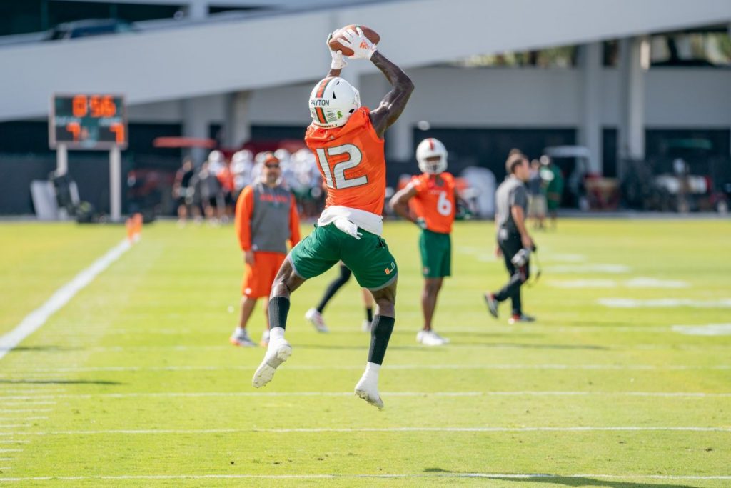 Redshirt Freshman wide receiver Jeremiah Payton leaps to catch the ball during the first day of Miami’s spring training on Wednesday, March 2 at the Greentree Practice Facility.