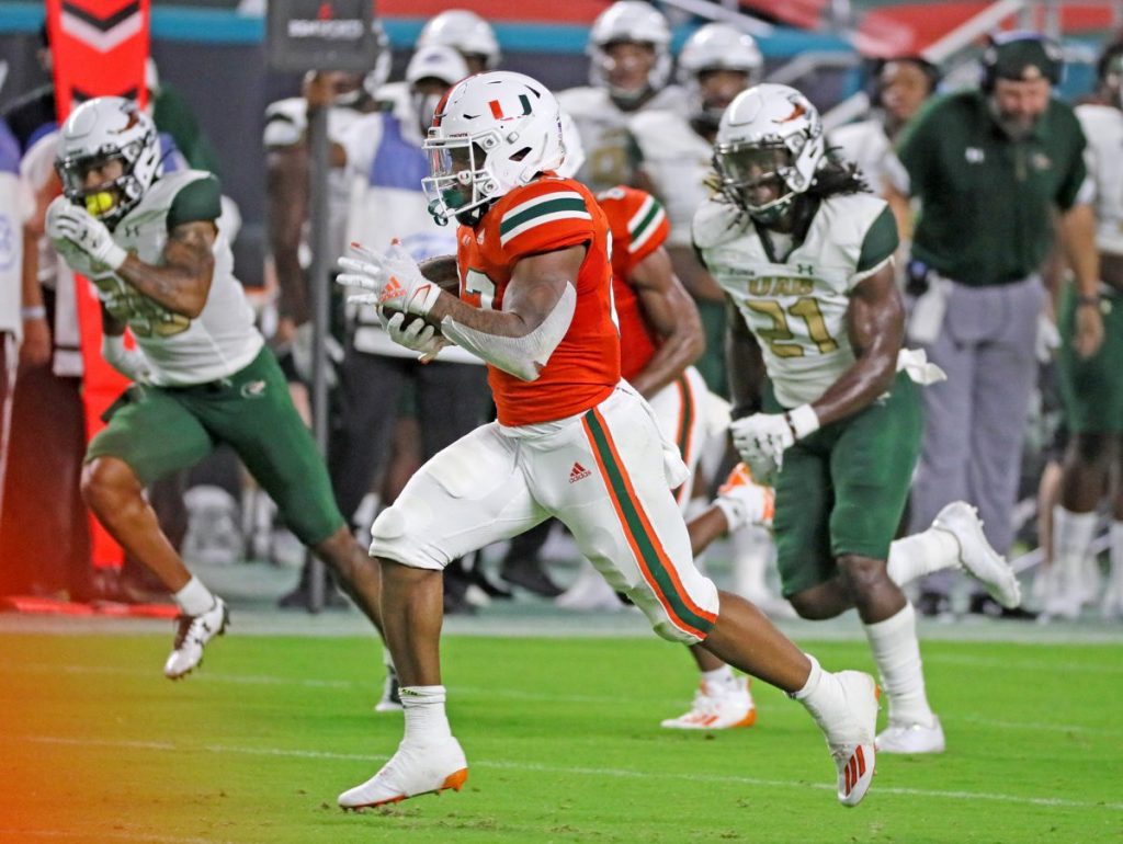 Junior running back Cam'Ron Harris (23) runs 66 yards for a first-quarter touchdown as the University of Miami hosts the UAB Blazers at Hard Rock Stadium on Thursday, September 10.