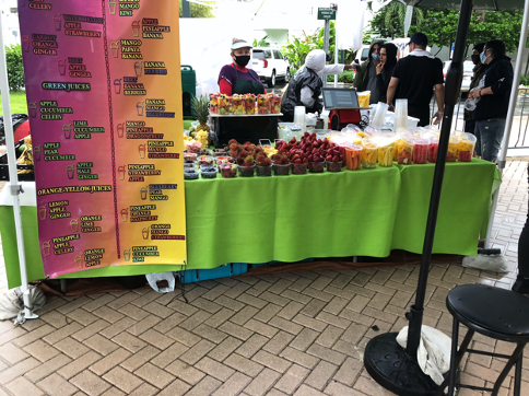Fresh Fruit stand attracts customers recently at the Well ‘Canes market.