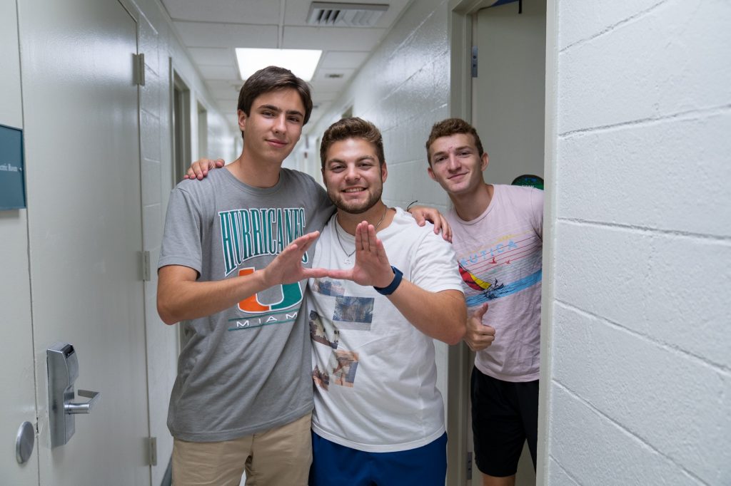 Patrick Mainente, Matt Seibre and Noah Cassius pose for a photo after moving into their rooms on Aug. 17, 2021.