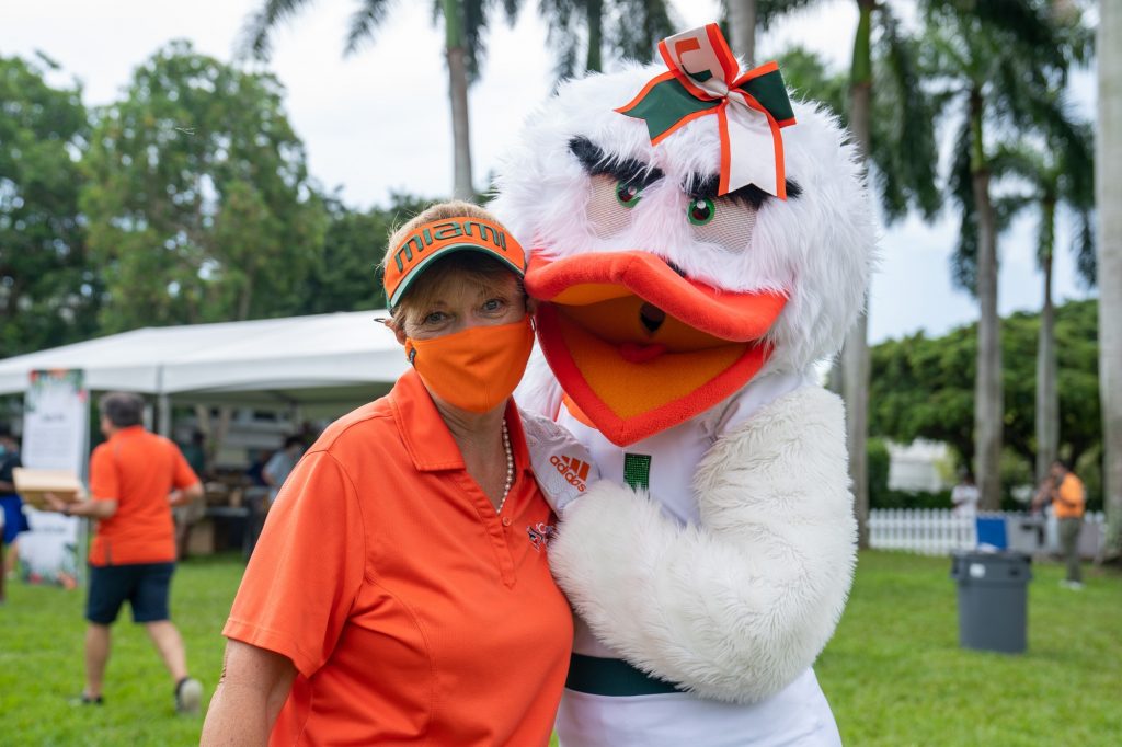 Senior Vice President for Student Affairs, Dr. Whitely, poses with a member of Sebastian the Ibis’ family during the Family Weekend Pep Rally & BBQ on the Foote Green on Sept. 24, 2021.