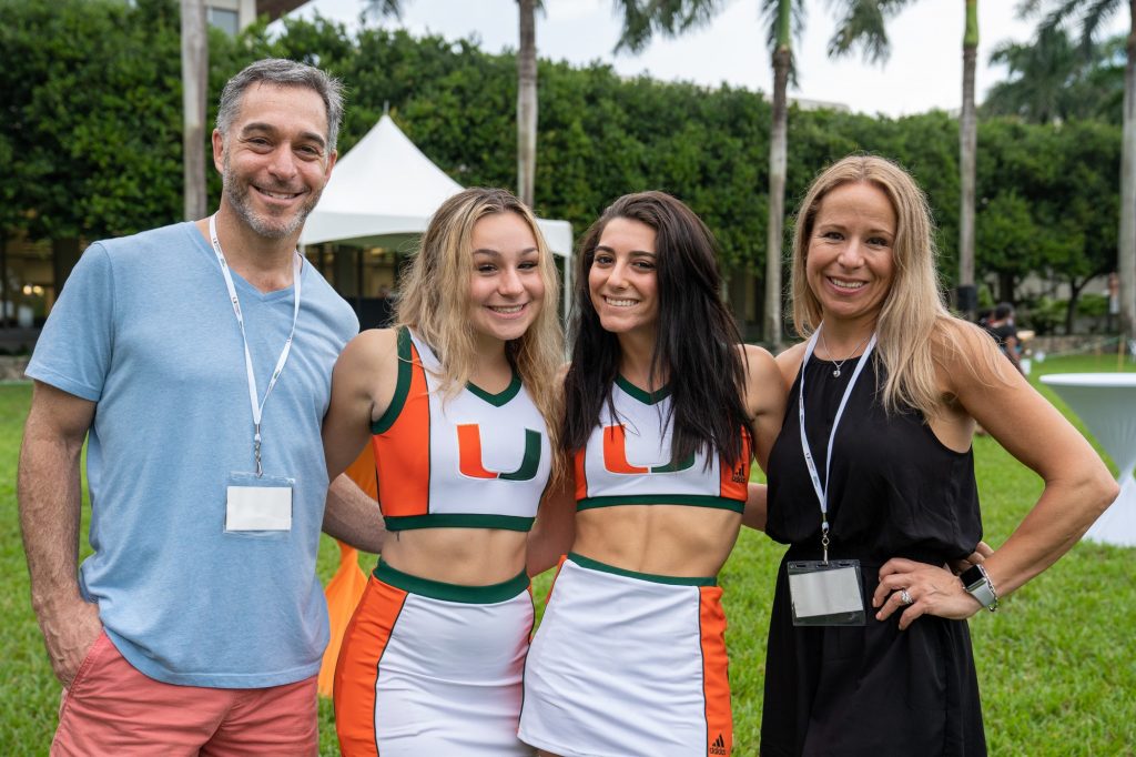 Sophomore Hannah Casper poses with parents Rodd and Susan, and sophomore teammate Via Carfagno during the Family Weekend Pep Rally & BBQ on the Foote Green on Sept. 24, 2021.