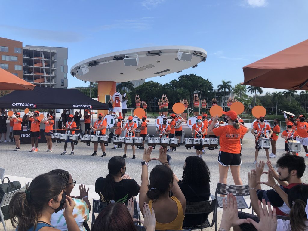 The Frost Band of the Hour and University of Miami Cheerleaders help students celebrate the announcement of this year's homecoming theme at Friday's pep rally.