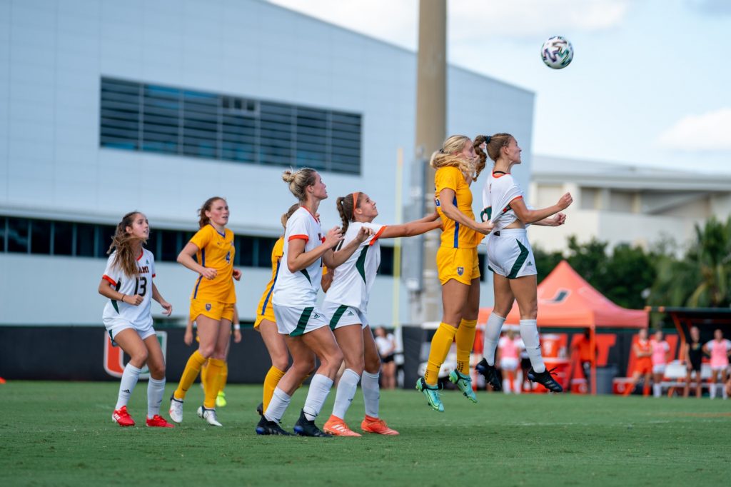 Sophomore forward/midfielder Gabriela Rusek jumps for a header during the second half of Miami’s match versus Pittsburgh at Cobb Stadium on Sept. 26, 2021.
