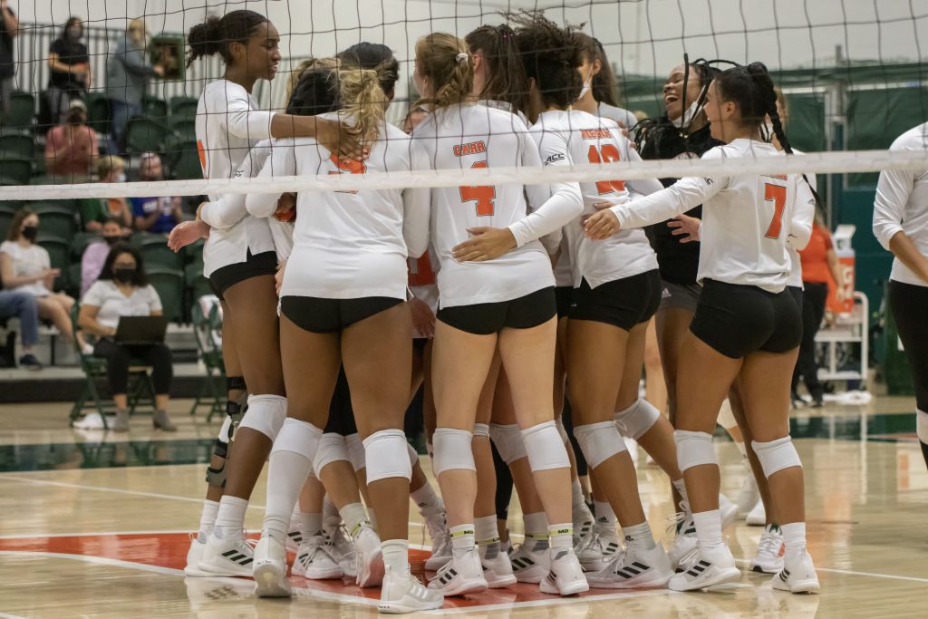 The Hurricanes celebrate after the winning point in their match against USF on Sept. 5, 2021. The Canes swept the Bulls 3-0, maintaining their undefeated record.