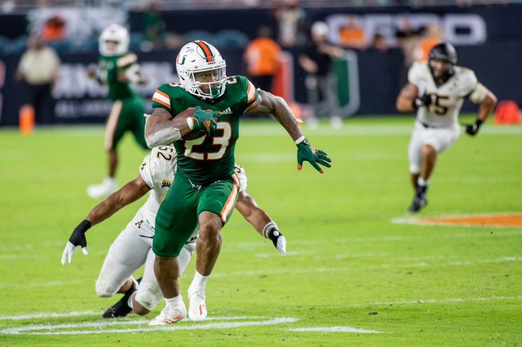 Junior Cam'Ron Harris carries the ball down the field in Miami's win over Appalachian State on Saturday Sept. 11 at Hard Rock Stadium. Harris will sit out the rest of the season after sustaining a right knee injury on Saturday against North Carolina.