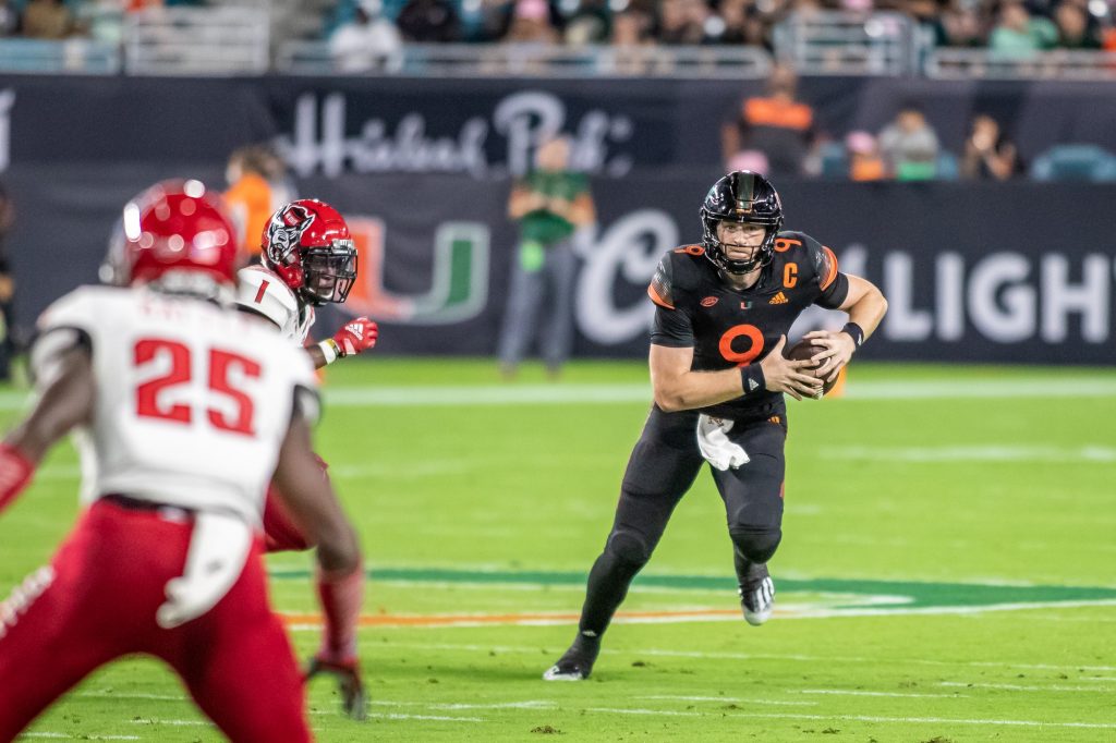 Freshman Tyler Van Dyke scrambled down the field during the first half of Miami’s win over NC State 31-30 Saturday Oct. 23 at Hard Rock Stadium in Miami. Van Dyke threw for 325 yards and had four touchdowns on the day.