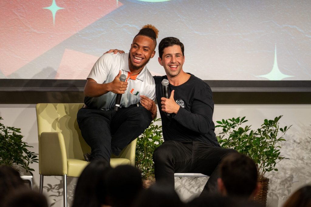 Josh Peck poses with student moderator Niles Boyd after repositioning to sit next to him at the conclusion of the What Matters to U event in the Shalala Center grand ballroom on Oct. 21, 2021.