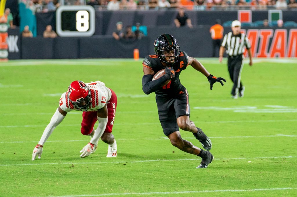 Redshirt junior wide receiver Charleston Rambo runs with the ball after catching a pass in the fourth quarter of Miami’s game versus NC State University at Hard Rock Stadium on Oct. 23, 2021.