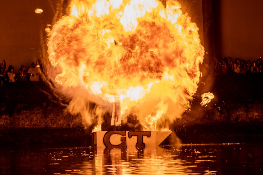 The wooden boat, painted with the logo and colors of UM's homecoming opponent, Georgia Tech, burst into flames in Lake Osceola on Nov. 5. According to UM tradition, if the mast falls before the boat sings, UM will win the Homecoming football game.
