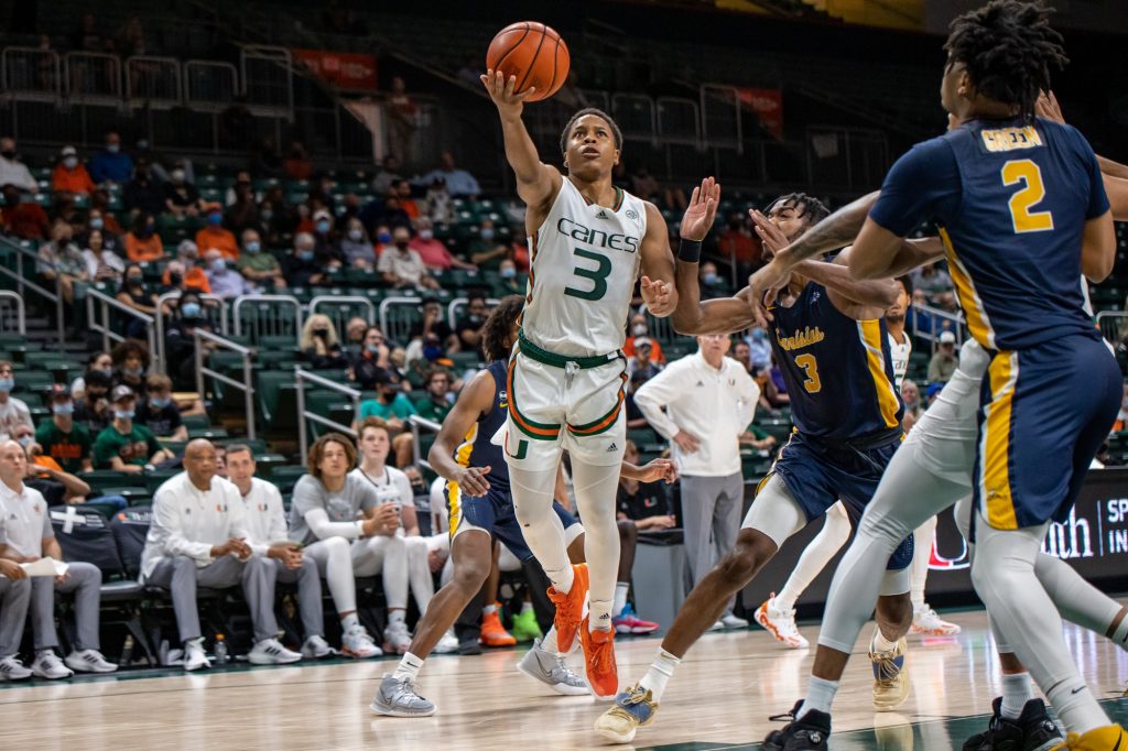 Sixth-year redshirt senior transfer Charlie Moore throws up a floater in Miami's win on Tuesday, Nov. 9 at the Watsco Center